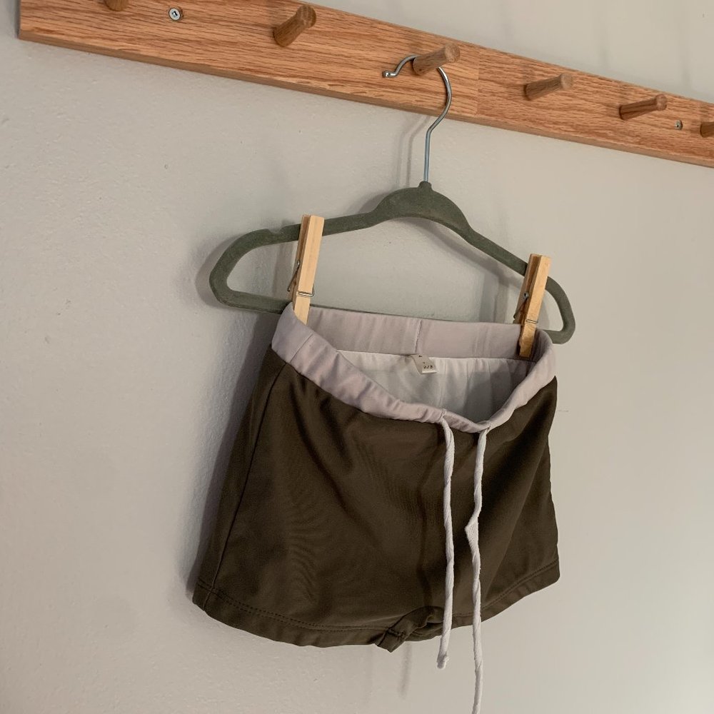 OAT green swim trunks